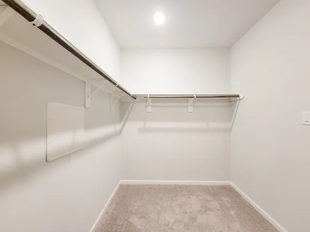 a view of an empty walk in closet