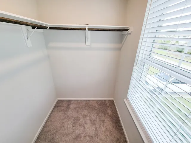 a view of a room with racks on the wall