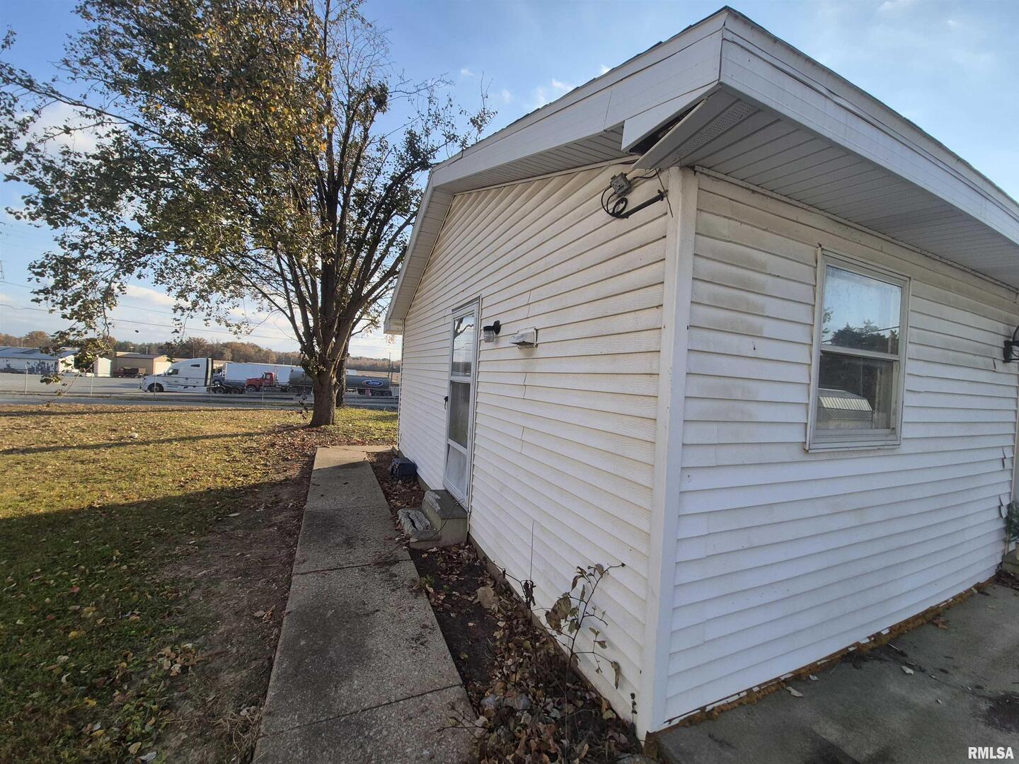 802 Dillard Street Eldorado, IL 62930 - Photo 20 of 28 a view of a house with backyard and trees