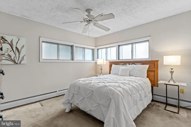 a bedroom with bed and window