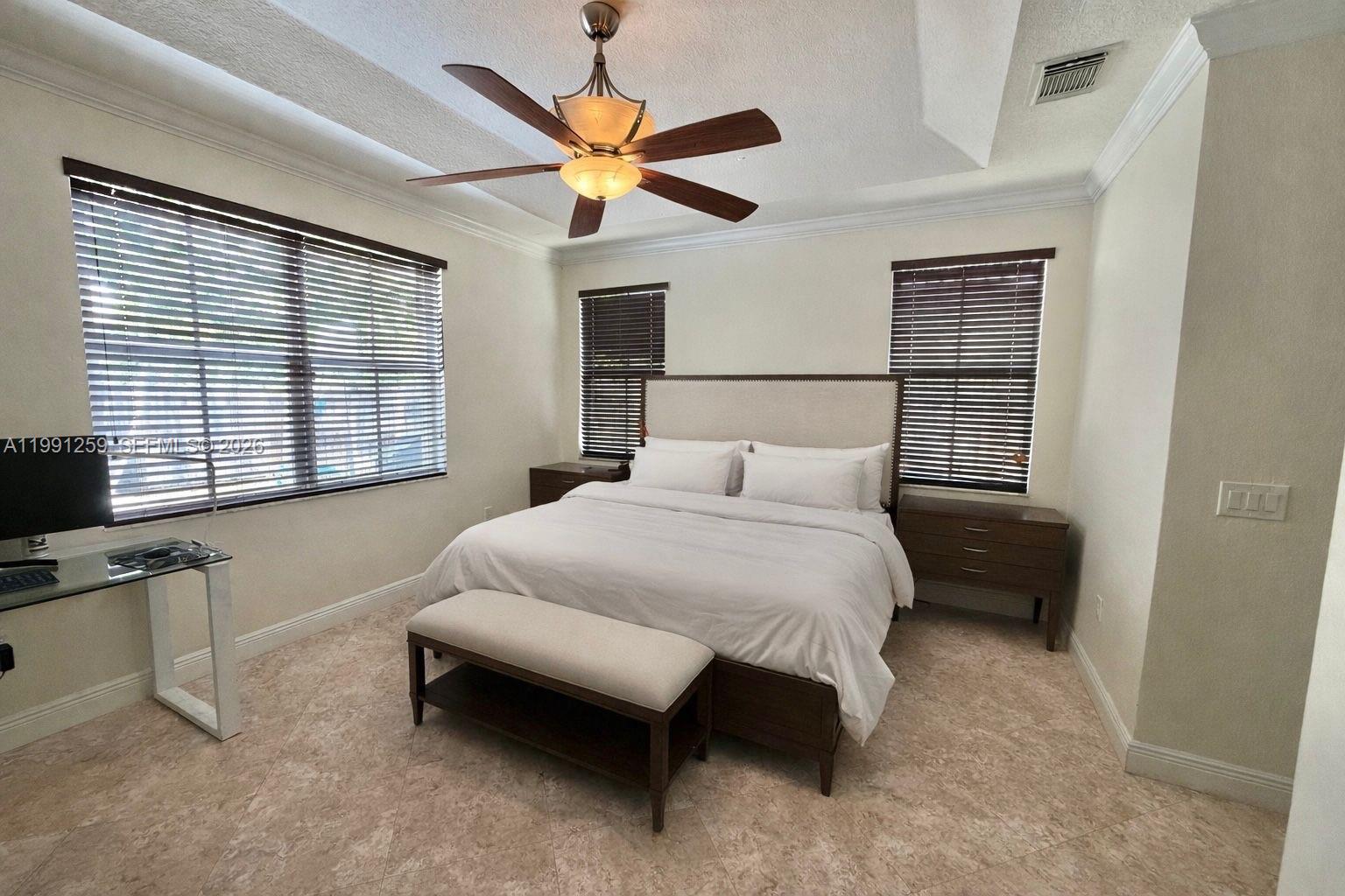 15391 Southwest 17th Terrace Miami, FL 33185 - Photo 12 of 16 a bedroom with a bed and a large window