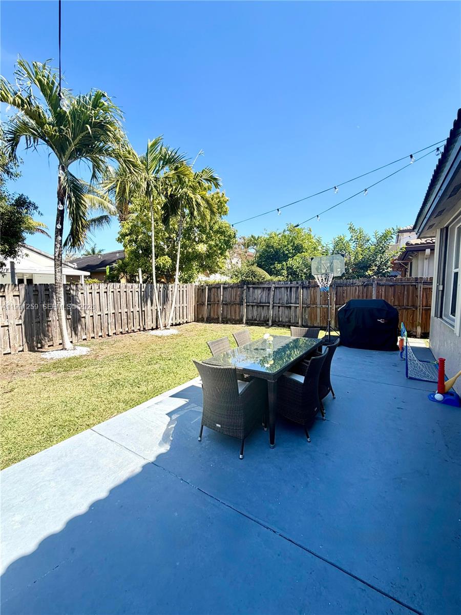 15391 Southwest 17th Terrace Miami, FL 33185 - Photo 15 of 16 a view of swimming pool with outdoor seating and yard