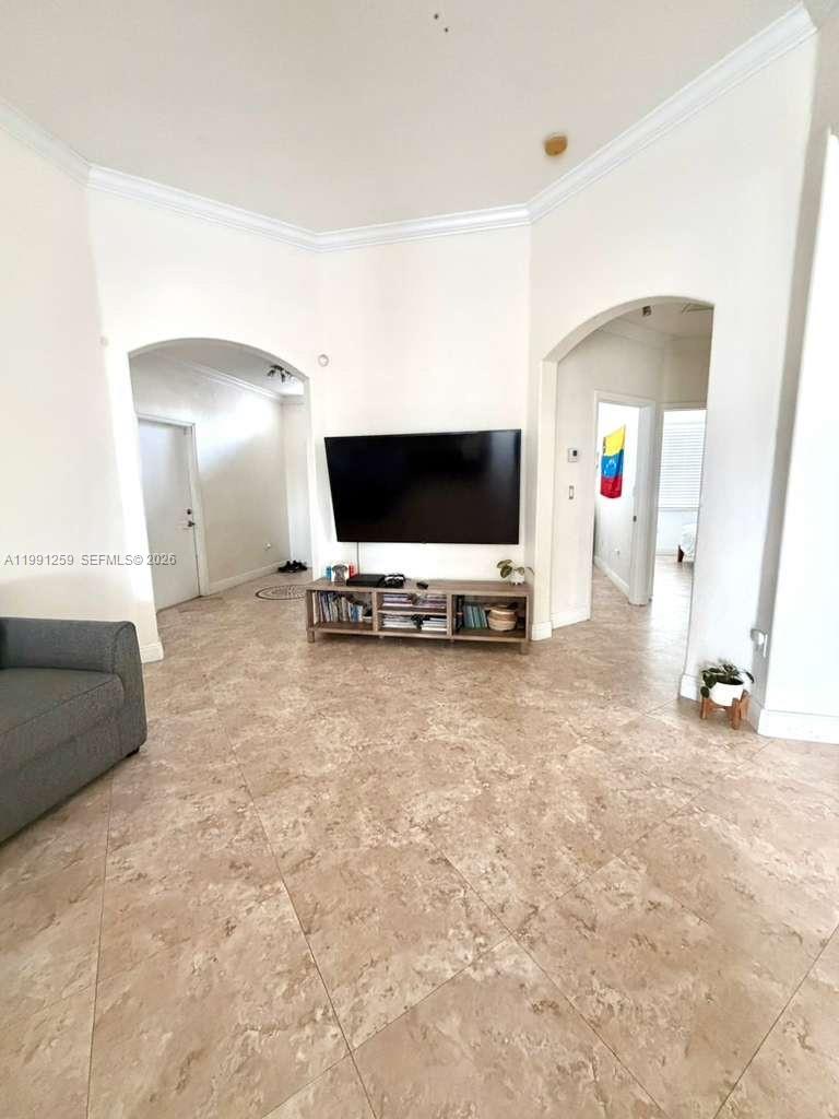 15391 Southwest 17th Terrace Miami, FL 33185 - Photo 3 of 16 a view of a livingroom with furniture and a flat screen tv