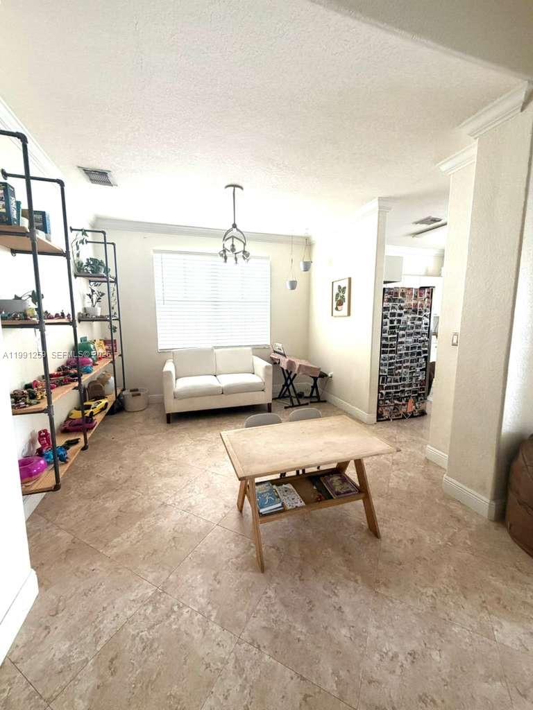 15391 Southwest 17th Terrace Miami, FL 33185 - Photo 4 of 16 a living room with furniture