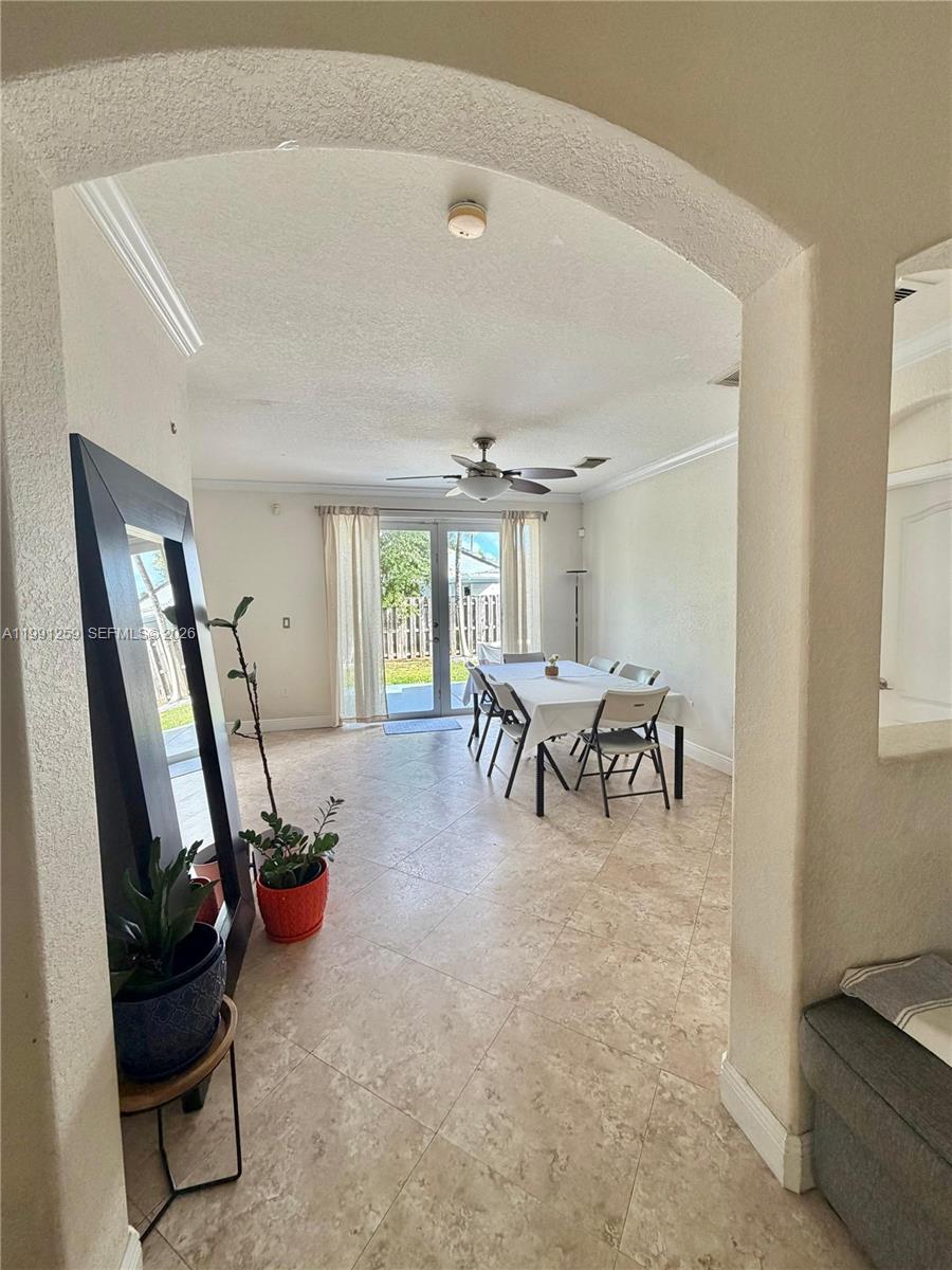 15391 Southwest 17th Terrace Miami, FL 33185 - Photo 5 of 16 a living room with furniture and a large window