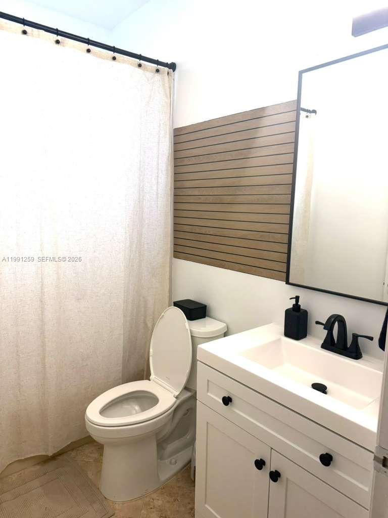 15391 Southwest 17th Terrace Miami, FL 33185 - Photo 7 of 16 a bathroom with a sink and a mirror