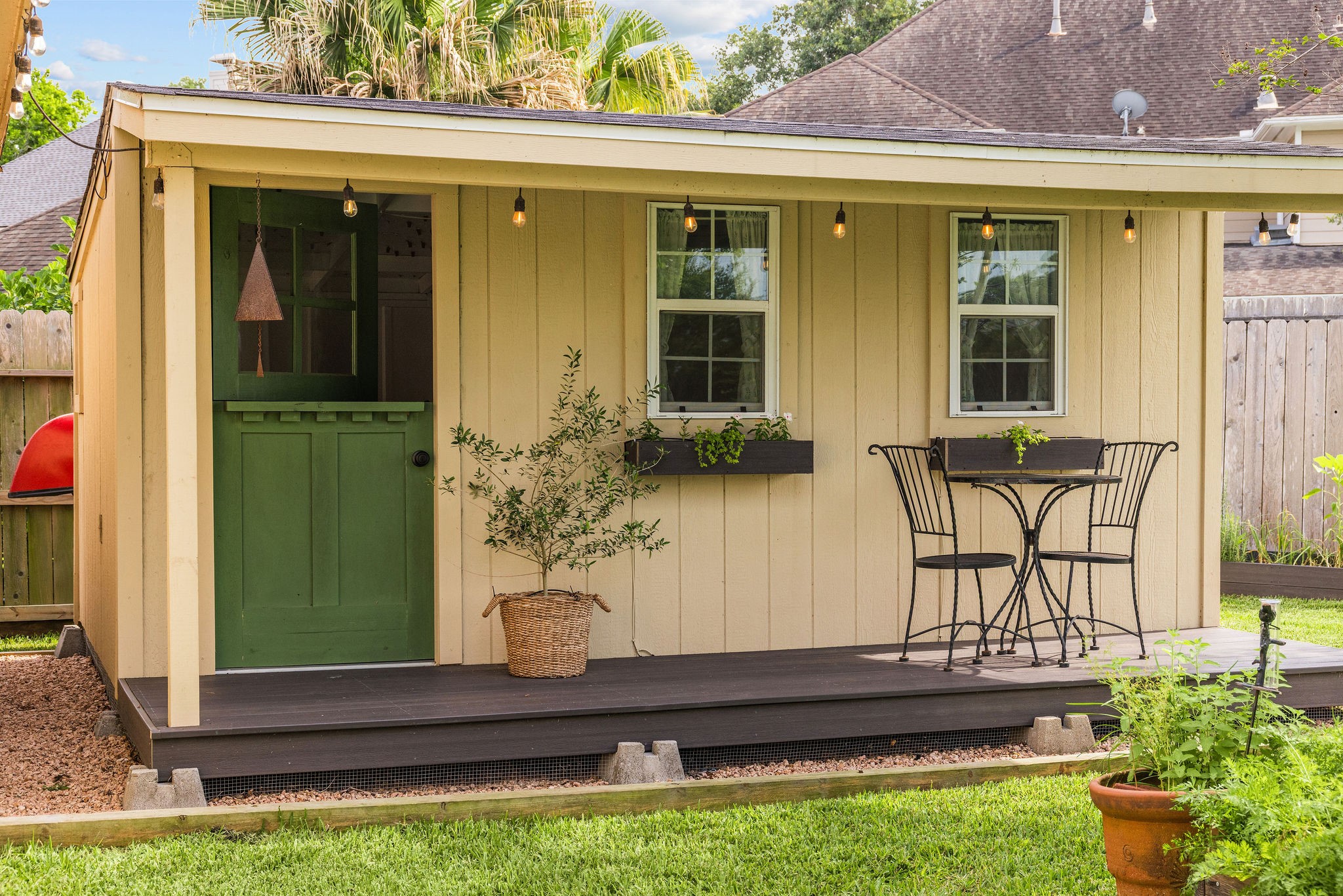 9603 Randon Lane Missouri City, TX 77459 - Photo 40 of 50 Charming hand crafted shed with window boxes and a large side opening could double as storage for yard equipment or bikes, pool and yard toys or be used as a play house for kids.