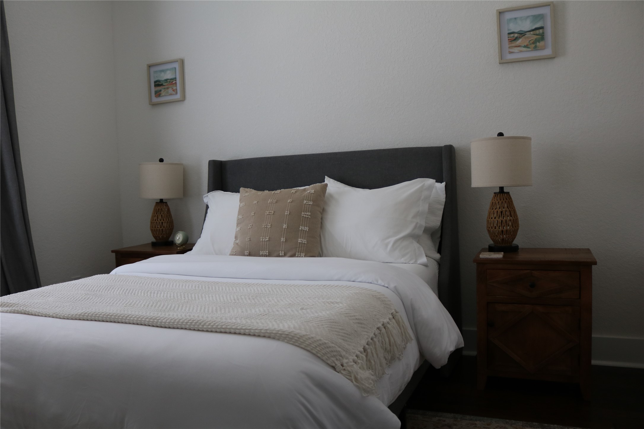 4714 Fisk Street Houston, TX 77009 - Photo 16 of 20 a bedroom with a bed and a lamp on the dresser