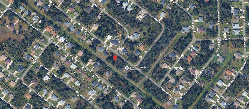 Woodward Ave Port North Port, FL 34286 - Photo 6 of 7 a backyard of a building with large trees
