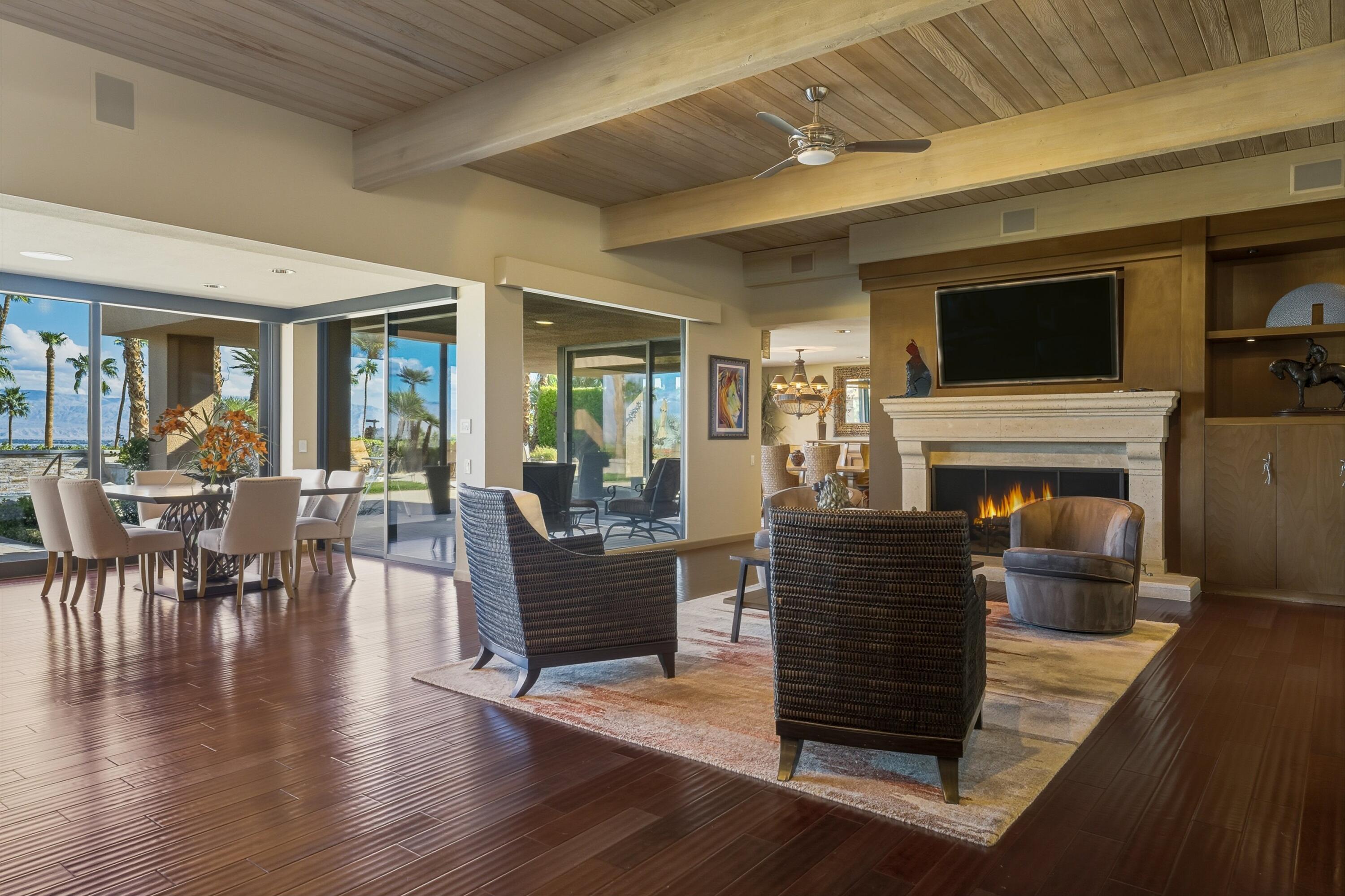 70150 Thunderbird Road Rancho Mirage, CA 92270 - Photo 13 of 67 a living room with furniture a flat screen tv and a fireplace