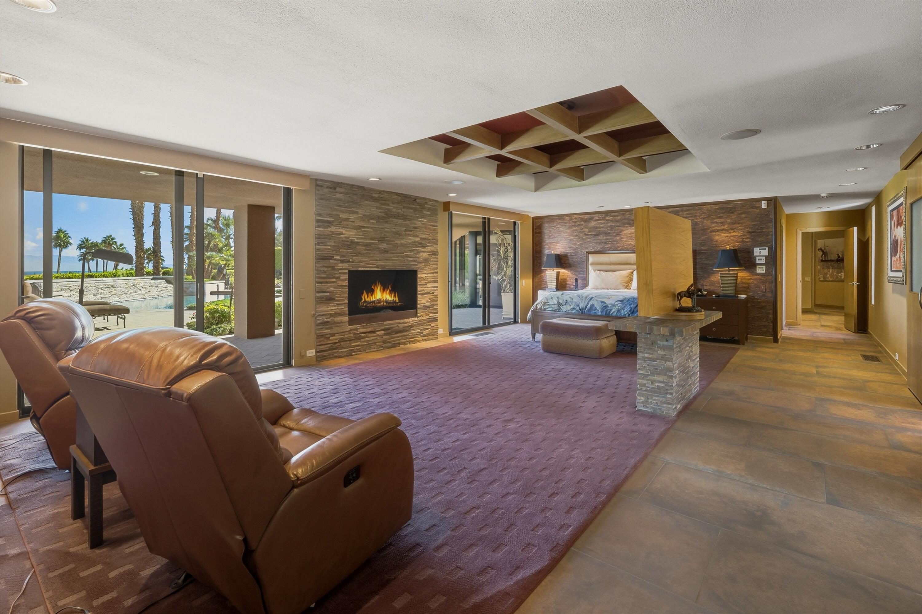 70150 Thunderbird Road Rancho Mirage, CA 92270 - Photo 35 of 67 a bedroom with furniture and large windows