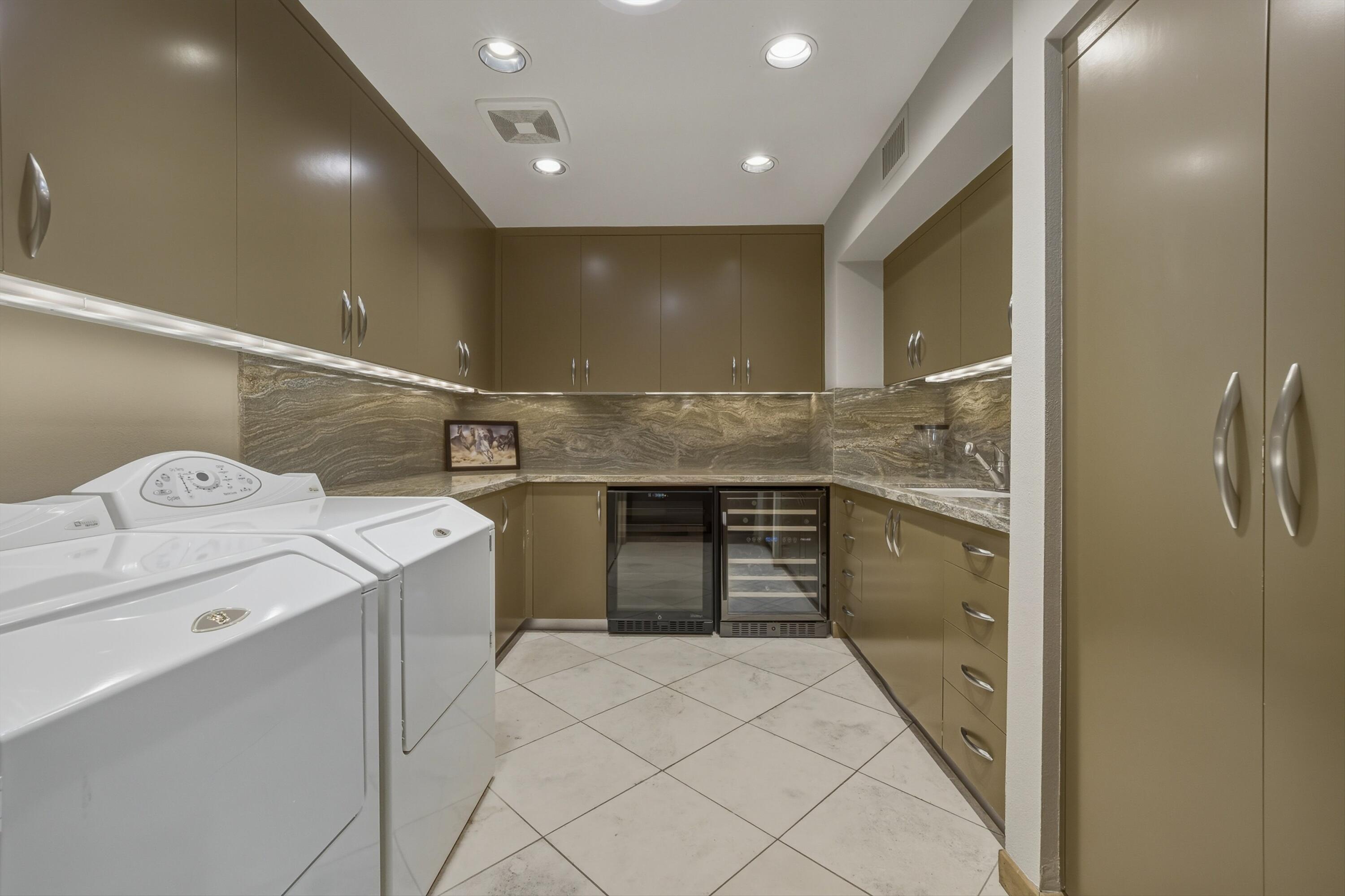 70150 Thunderbird Road Rancho Mirage, CA 92270 - Photo 52 of 67 a kitchen with a sink and cabinets