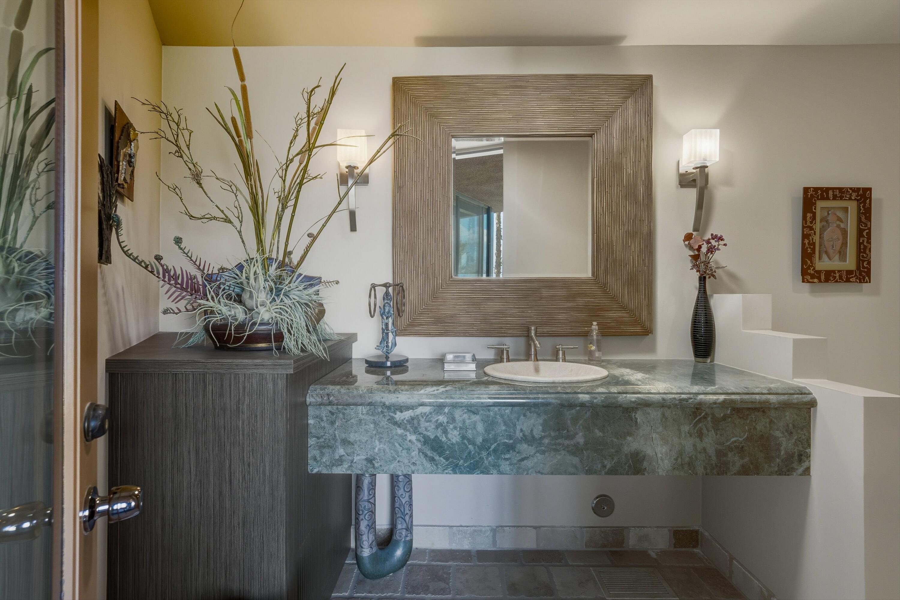70150 Thunderbird Road Rancho Mirage, CA 92270 - Photo 54 of 67 a bathroom with a granite countertop sink a mirror and vanity