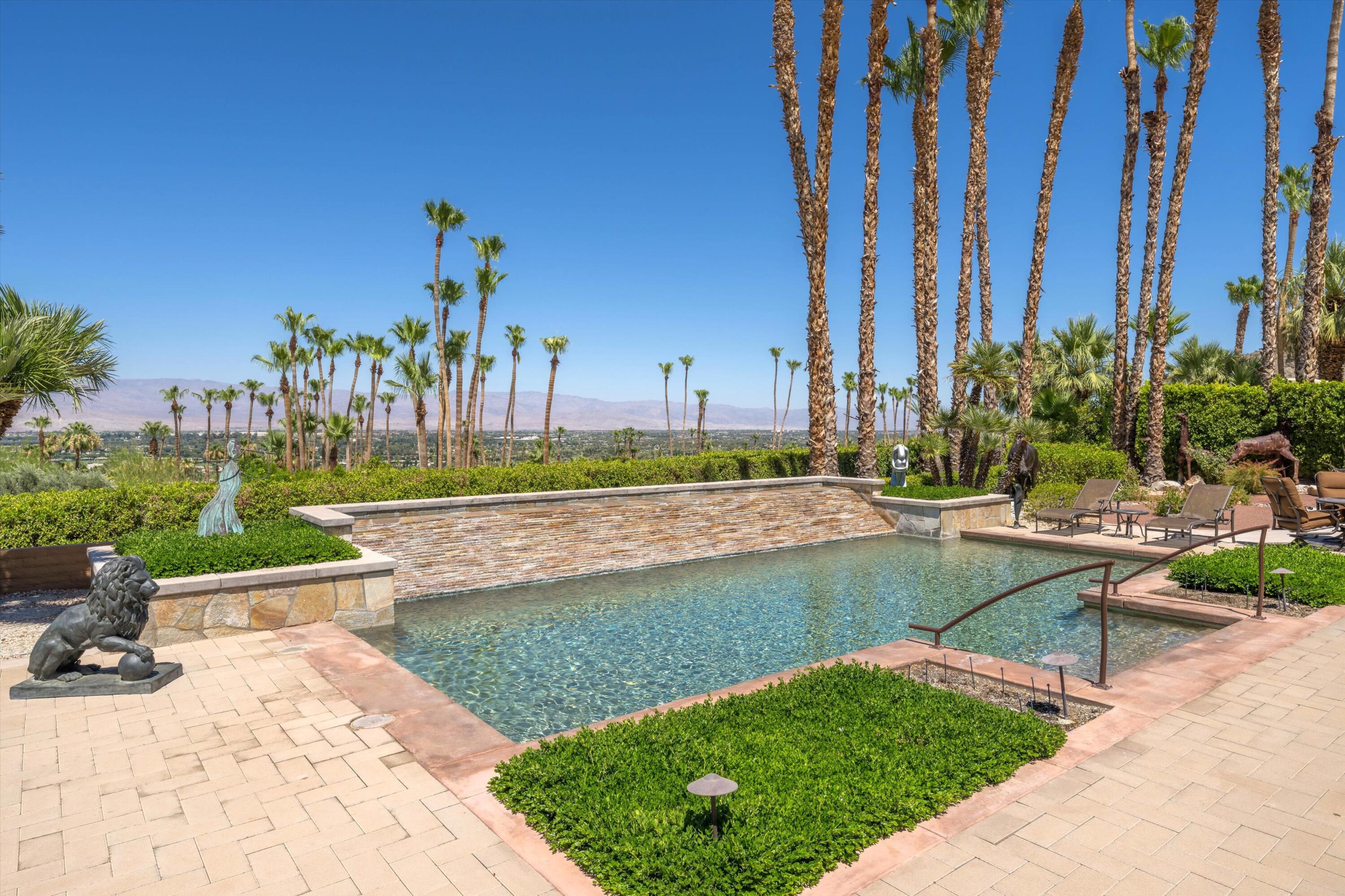 70150 Thunderbird Road Rancho Mirage, CA 92270 - Photo 56 of 67 a view of a swimming pool with a patio