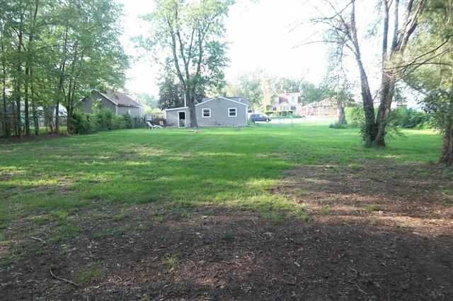 609 Barry Road Rockford, IL 61109 - Photo 4 of 14 a view of a yard with palm trees
