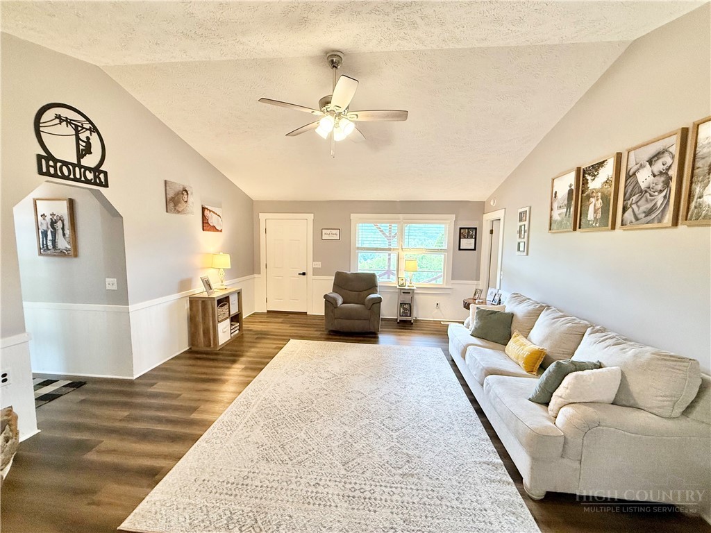 1315 Irwin Grocery Road Laurel Springs, NC 28644 - Photo 5 of 22 a living room with furniture and a chandelier