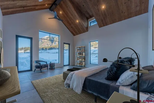 a bedroom with furniture and wooden floor