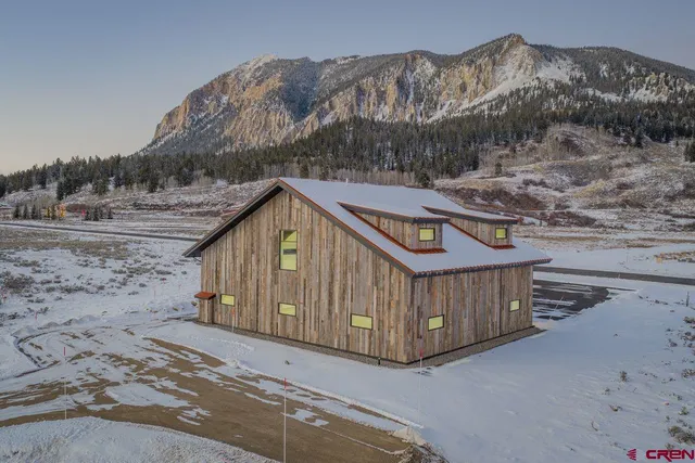 a view of a small house with a mountain