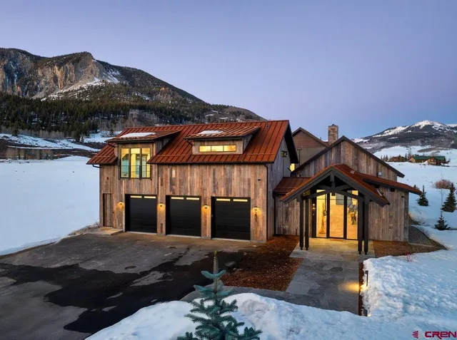 a bedroom with bed and a car parked