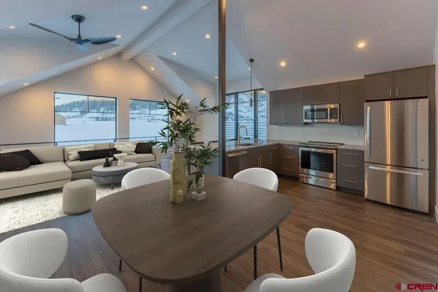 a bathroom with a shower sink and mirror