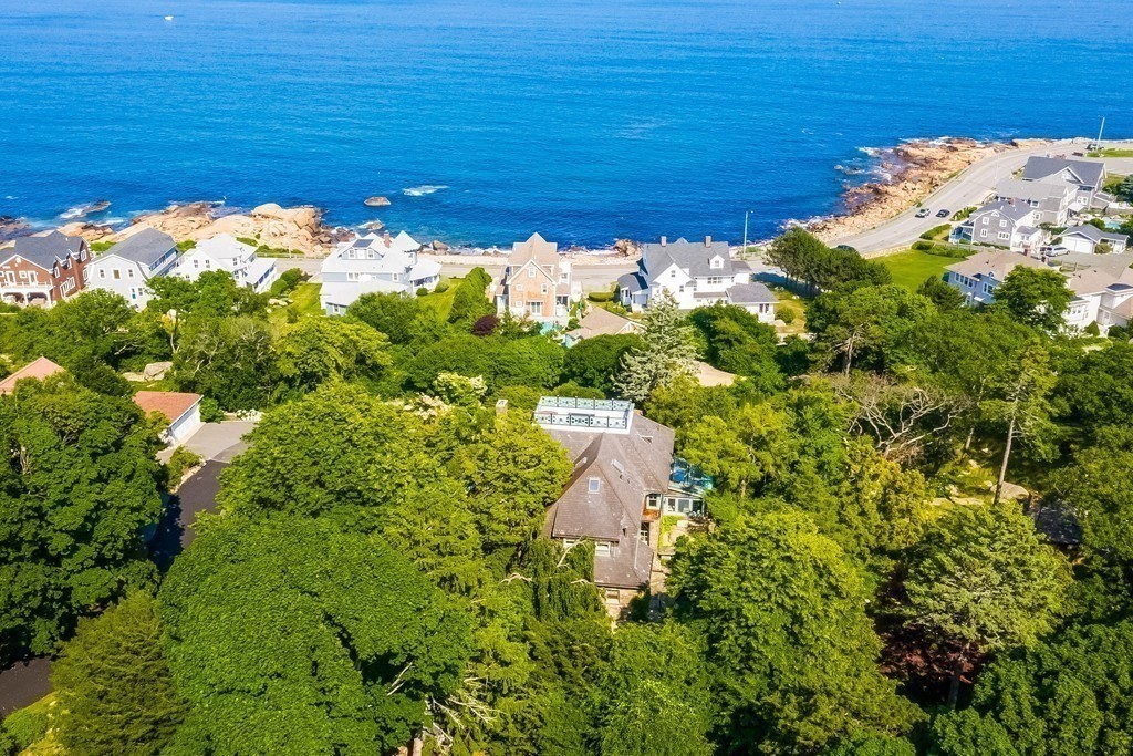 6 Brier Road Gloucester, MA 01930 - Photo 3 of 42 a view of a lake with a yard