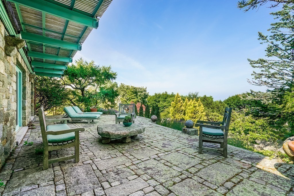 6 Brier Road Gloucester, MA 01930 - Photo 9 of 42 a chair and table in a backyard