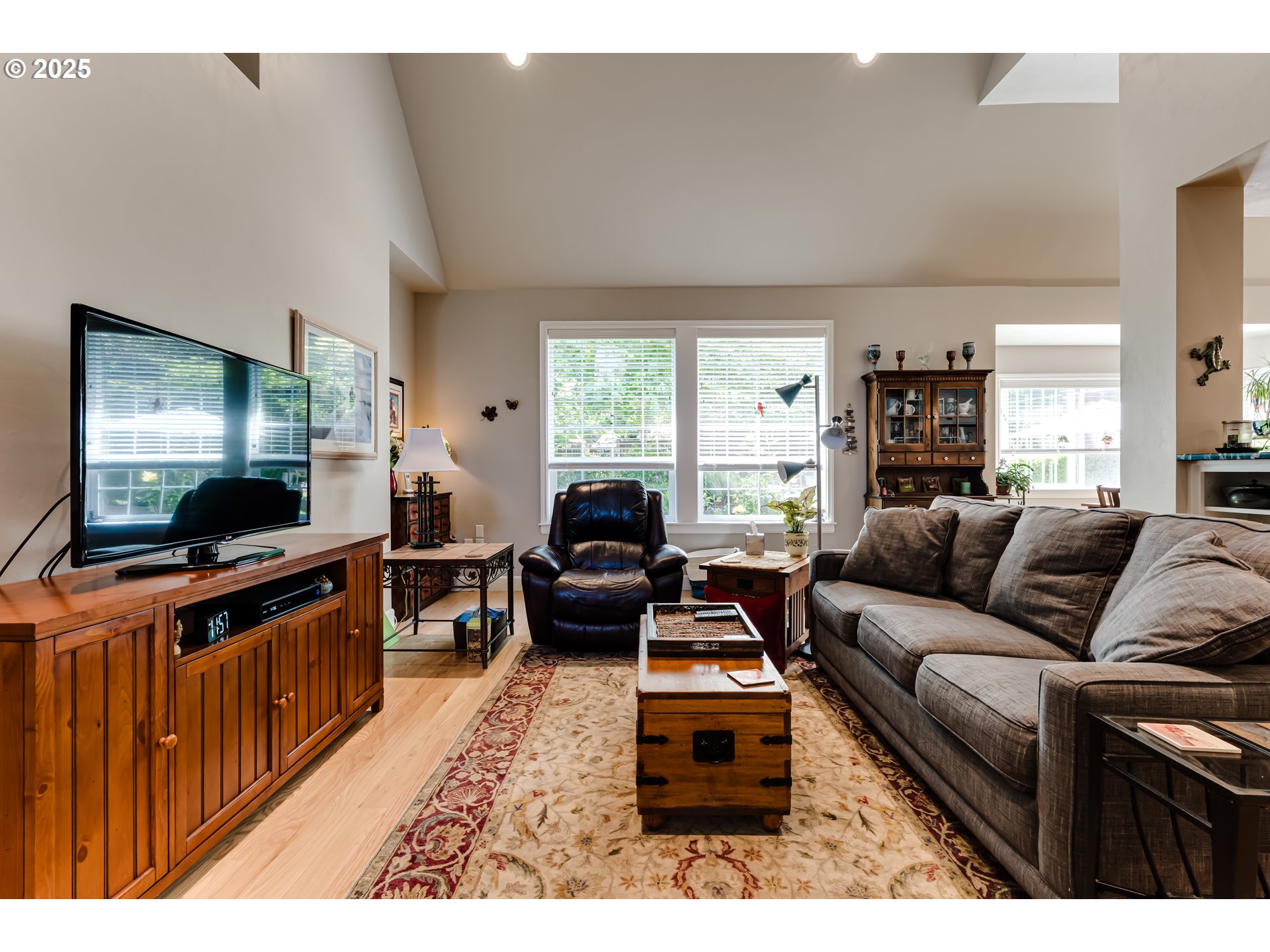 6111 Fernhill Loop Springfield, OR 97478 - Photo 12 of 48 a living room with furniture and a flat screen tv