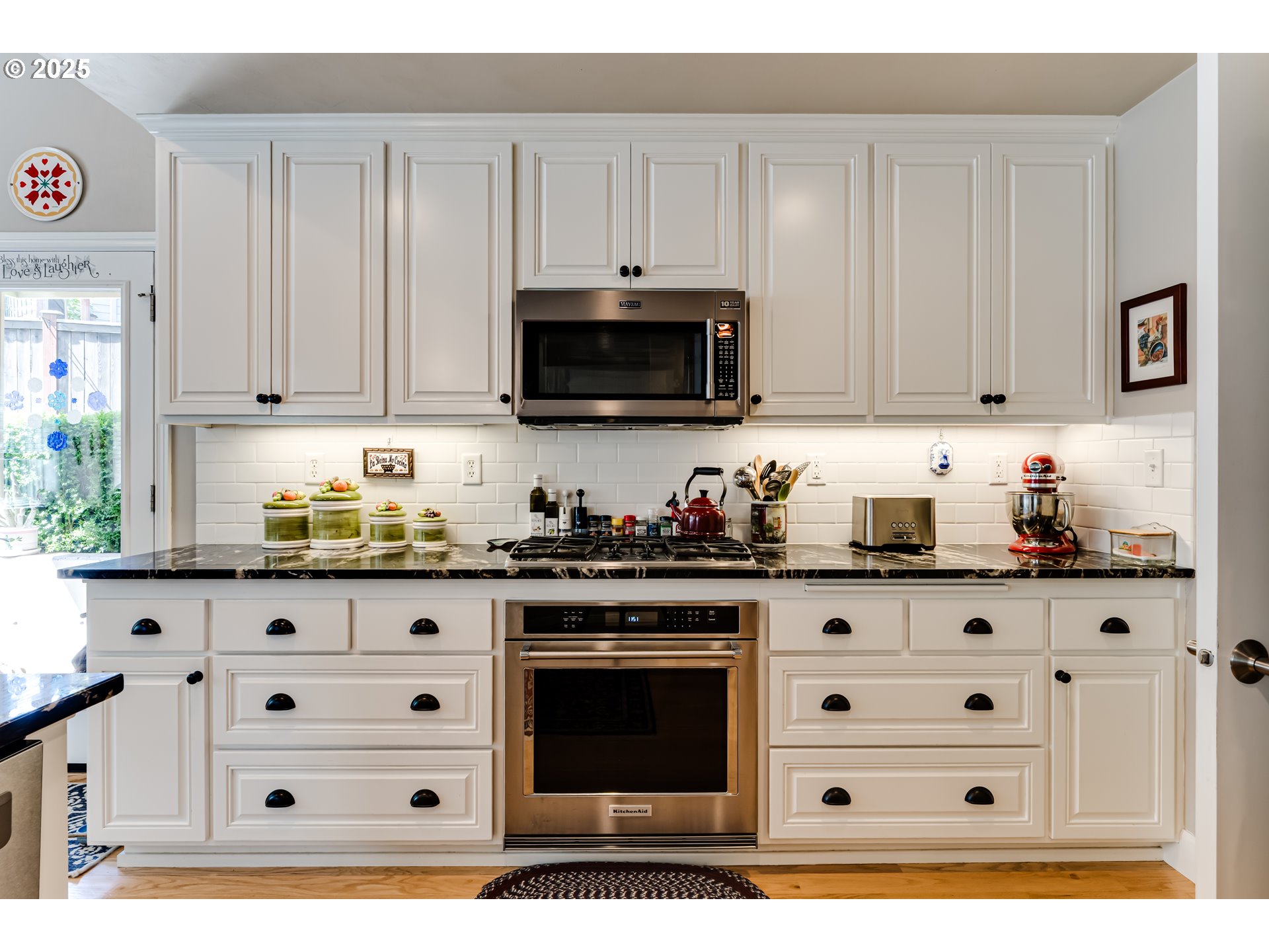 6111 Fernhill Loop Springfield, OR 97478 - Photo 20 of 48 a kitchen with granite countertop white cabinets and stainless steel appliances
