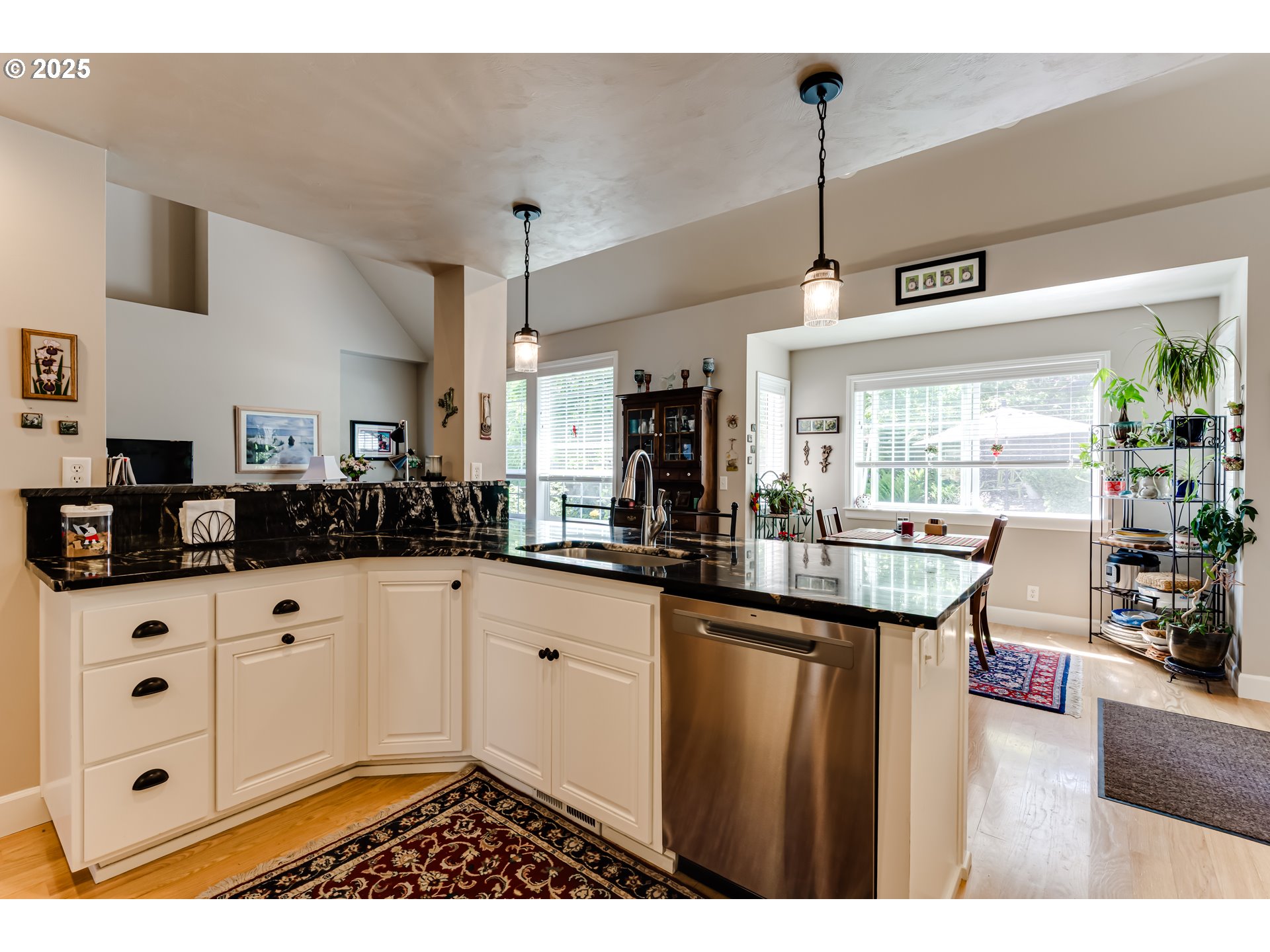 6111 Fernhill Loop Springfield, OR 97478 - Photo 21 of 48 a kitchen with granite countertop a sink and cabinets