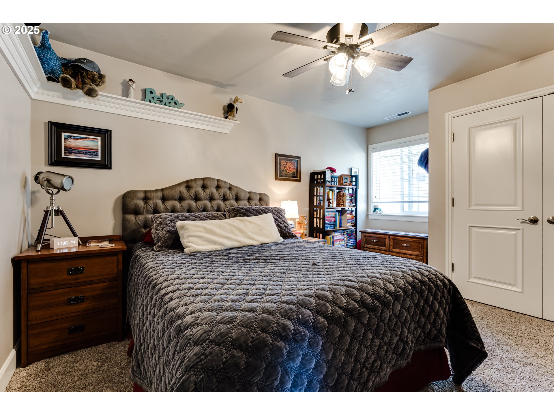 6111 Fernhill Loop Springfield, OR 97478 - Photo 31 of 48 a bedroom with a bed and a chandelier