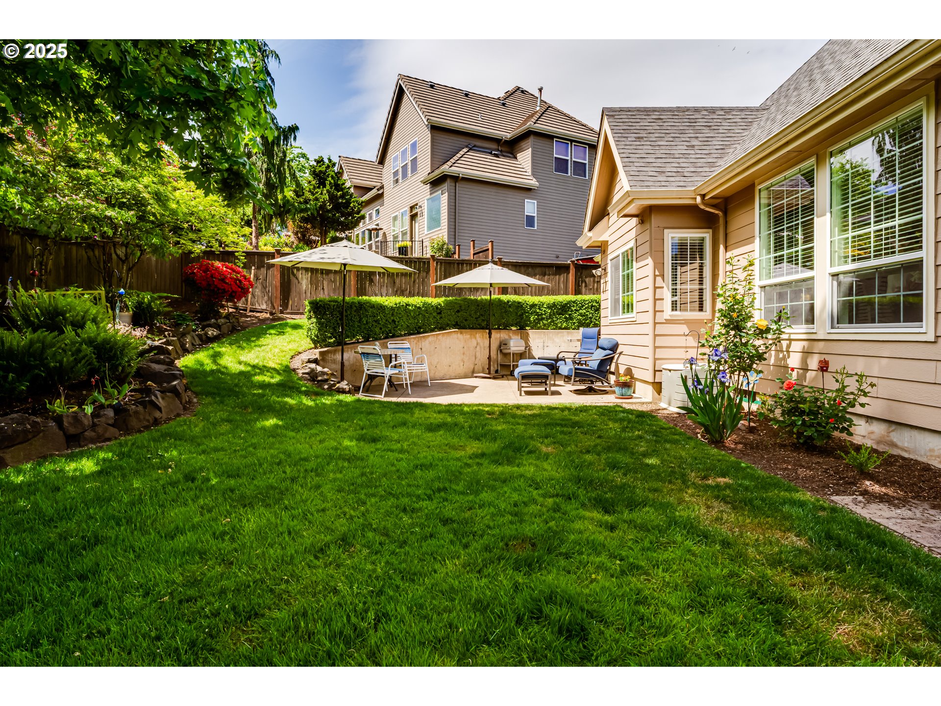 6111 Fernhill Loop Springfield, OR 97478 - Photo 41 of 48 a view of house with garden and chairs