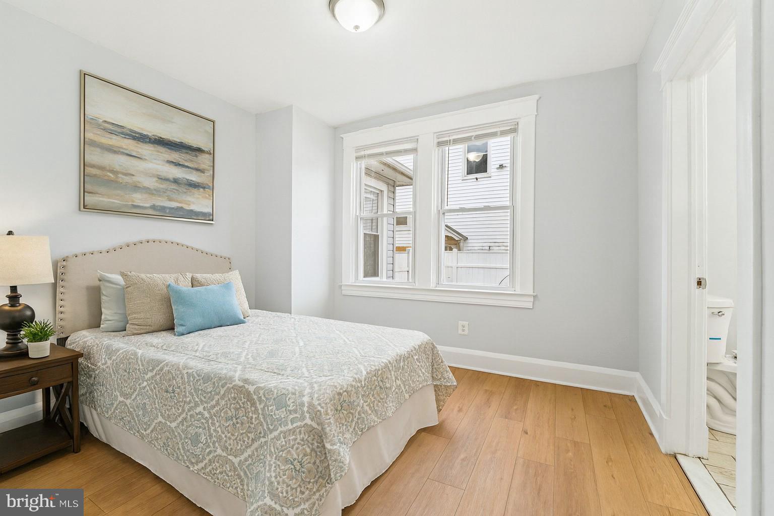 3030 Dunleer Road Dundalk, MD 21222 - Photo 11 of 26 a bedroom with a bed and wooden floor