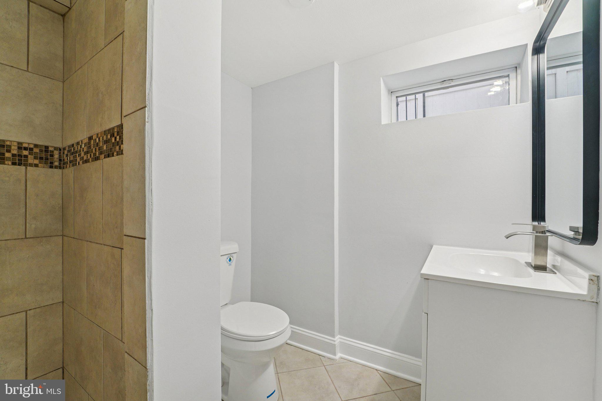 3030 Dunleer Road Dundalk, MD 21222 - Photo 15 of 26 a bathroom with a sink and a mirror