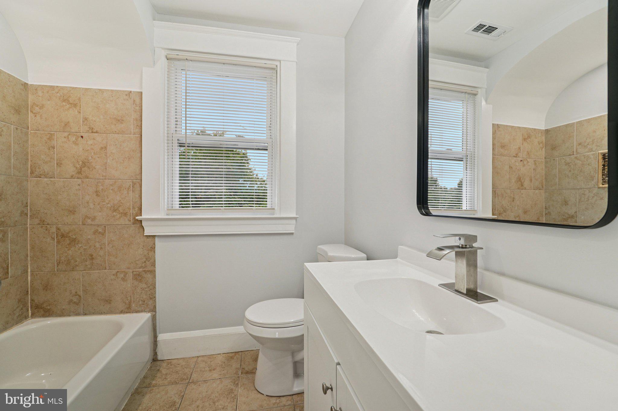 3030 Dunleer Road Dundalk, MD 21222 - Photo 16 of 26 a bathroom with a sink toilet and shower