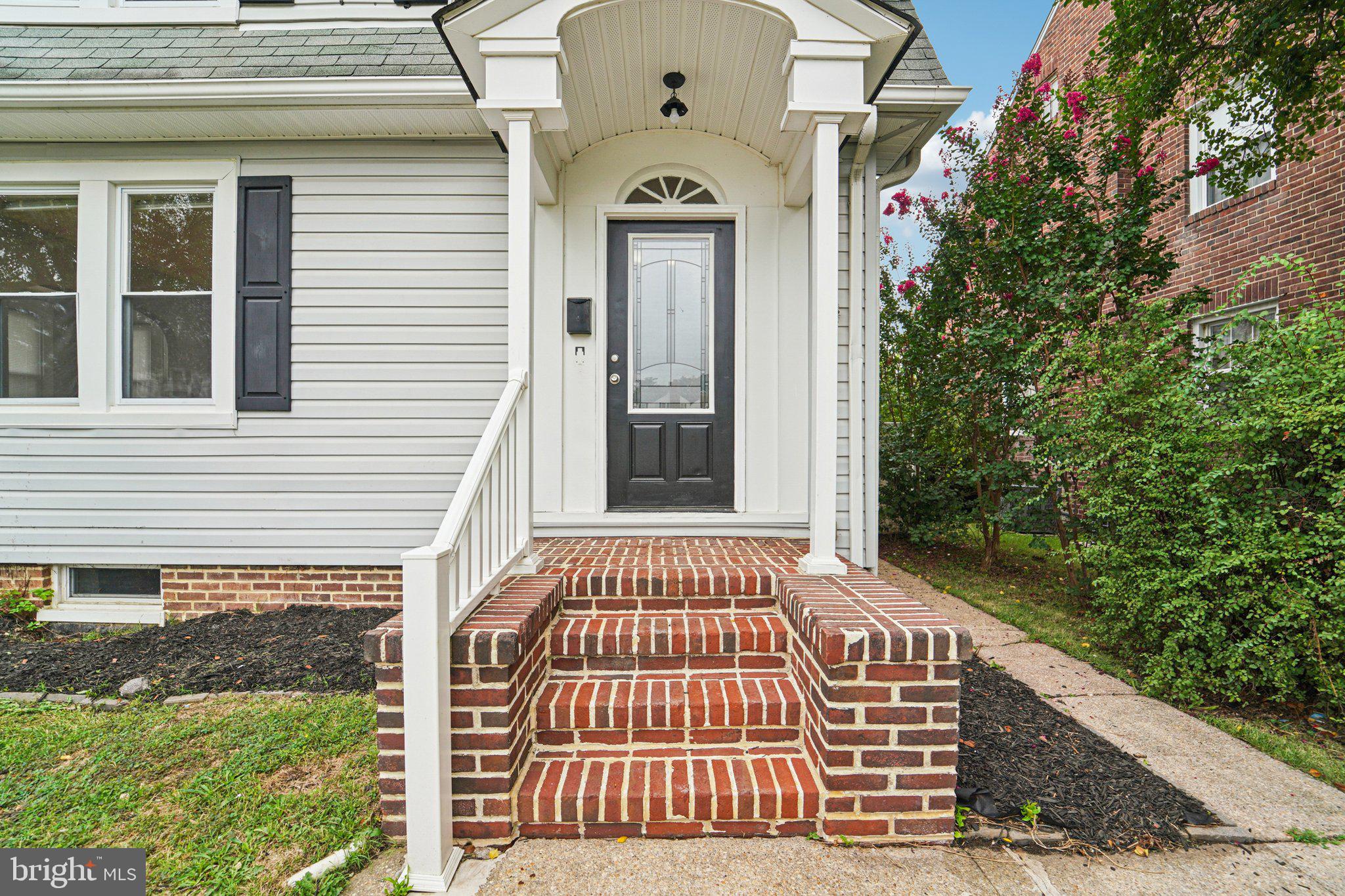 3030 Dunleer Road Dundalk, MD 21222 - Photo 2 of 26 a view of a brick house with large windows