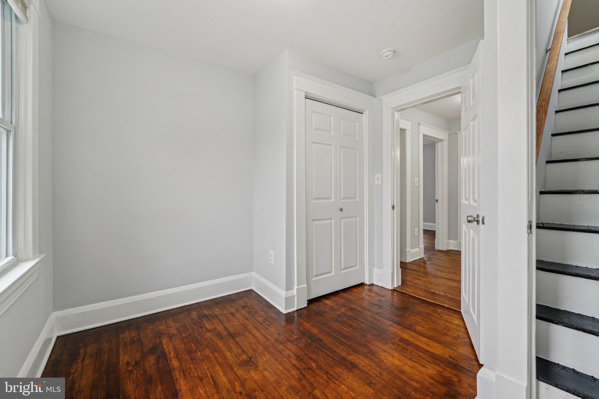 3030 Dunleer Road Dundalk, MD 21222 - Photo 21 of 26 a view of a hallway with wooden floor and entryway