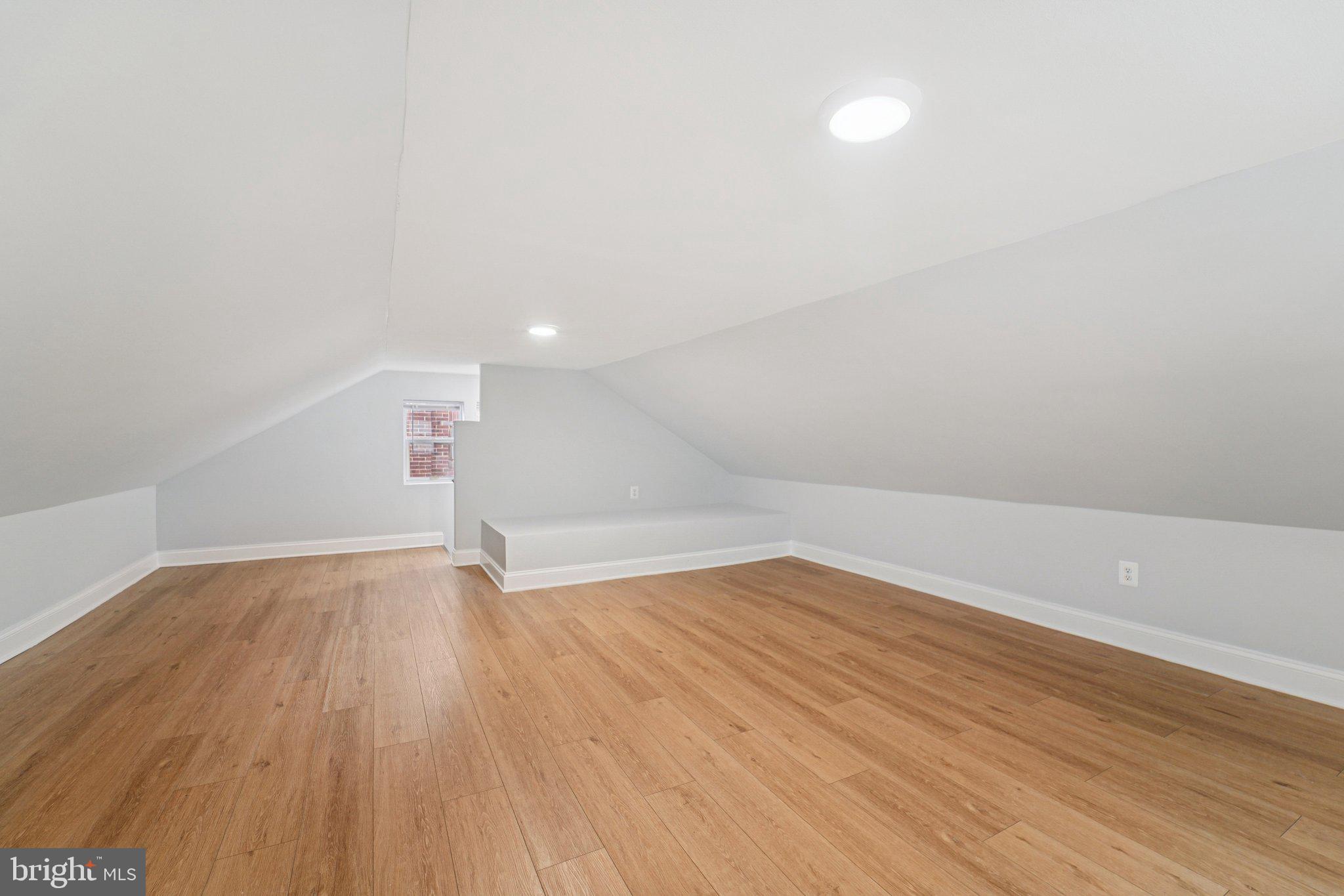 3030 Dunleer Road Dundalk, MD 21222 - Photo 22 of 26 a view of an empty room with wooden floor