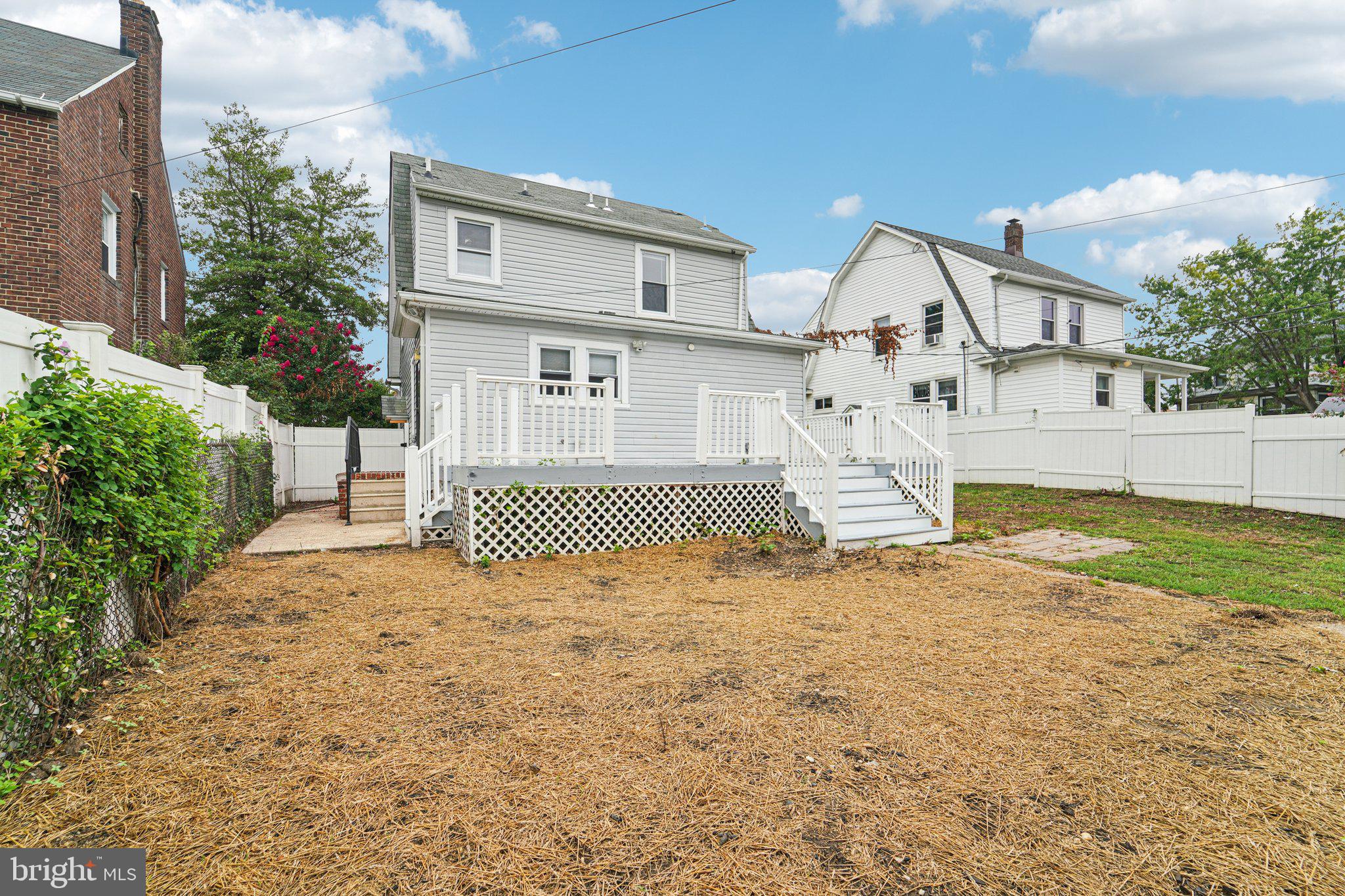 3030 Dunleer Road Dundalk, MD 21222 - Photo 26 of 26 a view of a house with a yard and garage