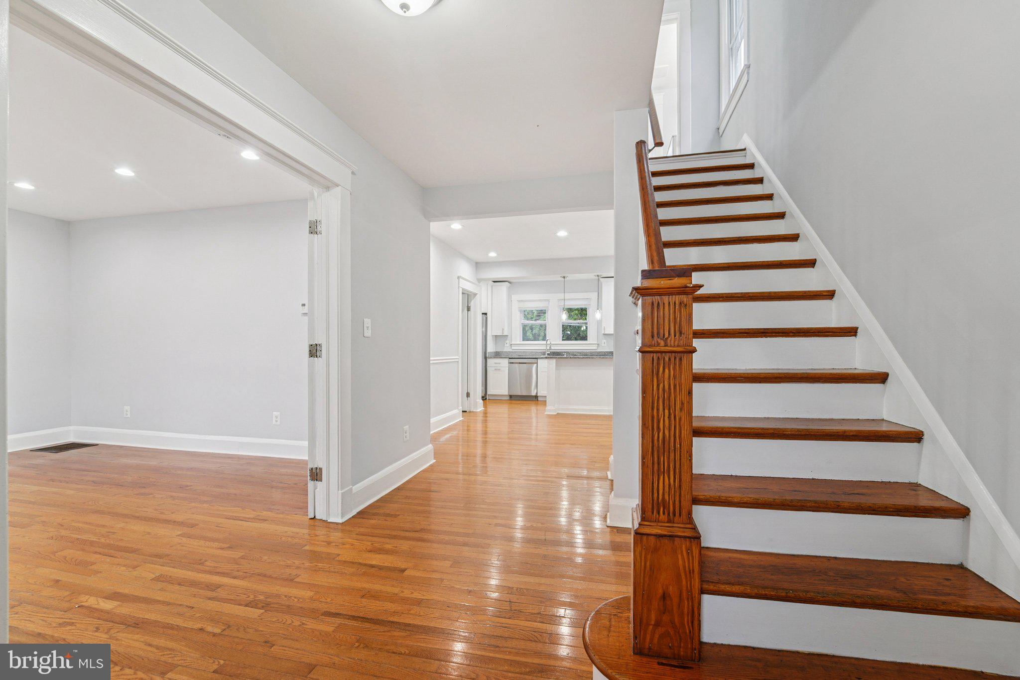 3030 Dunleer Road Dundalk, MD 21222 - Photo 3 of 26 a view of a room with wooden floor and stairs