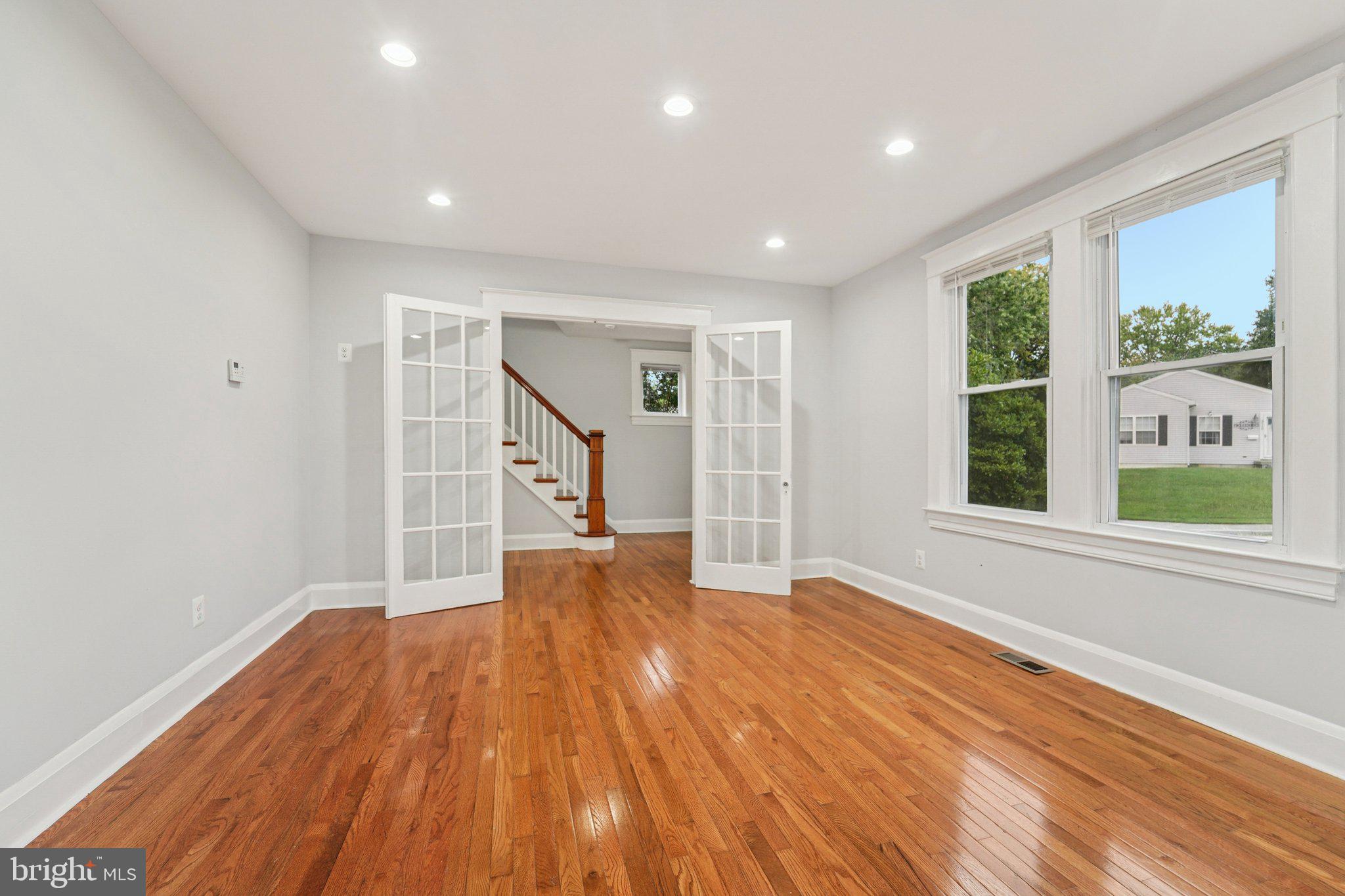3030 Dunleer Road Dundalk, MD 21222 - Photo 5 of 26 a view of empty room with wooden floor and fan