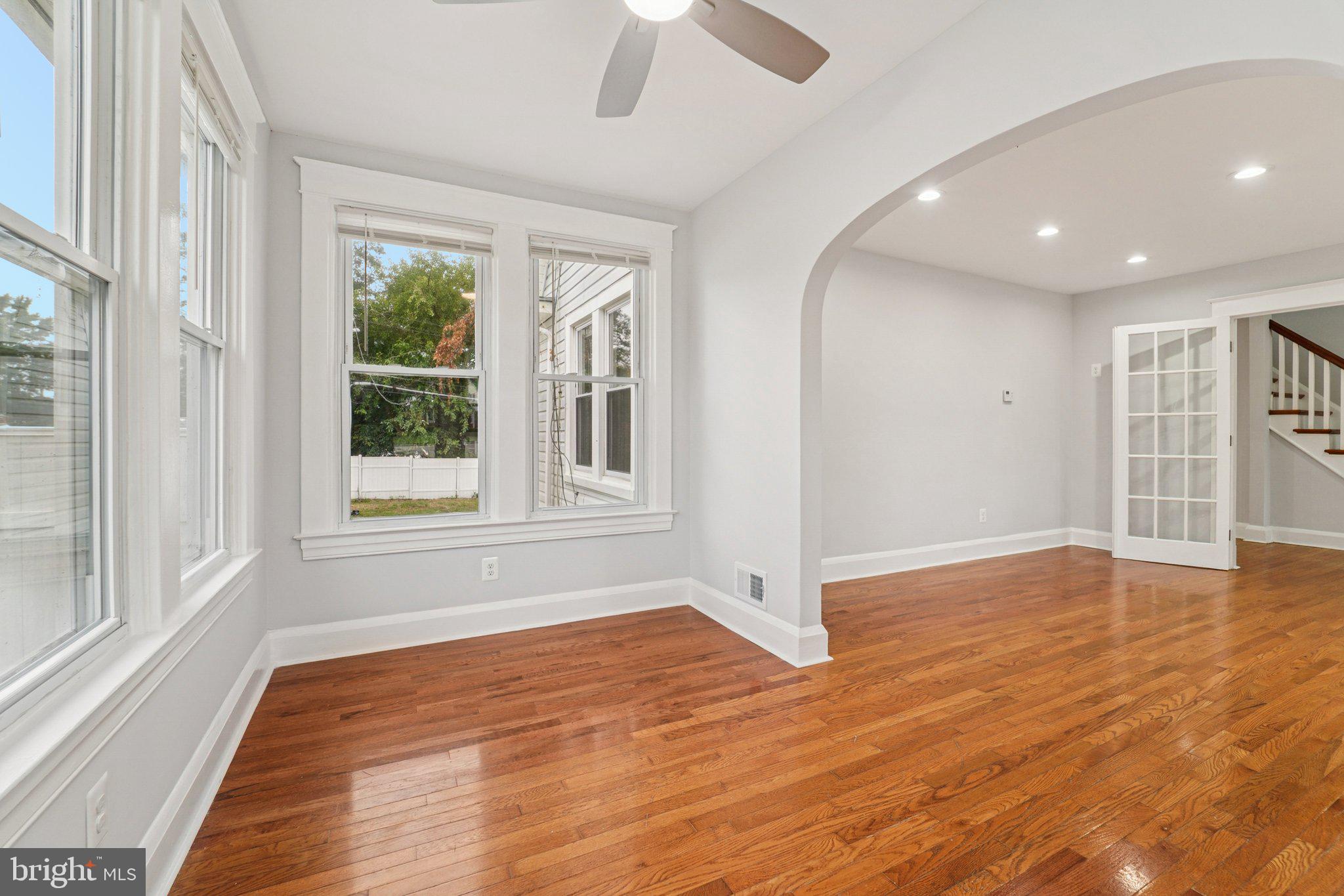 3030 Dunleer Road Dundalk, MD 21222 - Photo 7 of 26 a view of an empty room with wooden floor and a window