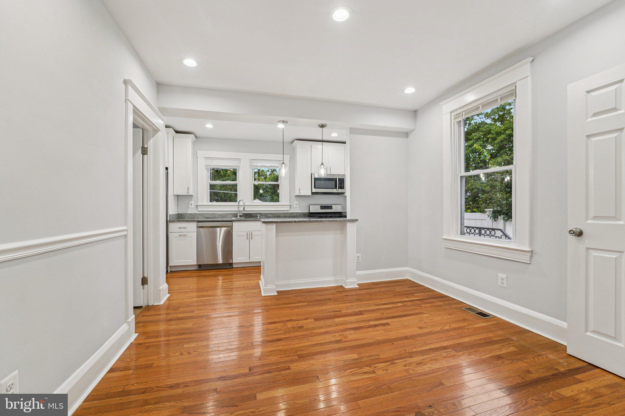 3030 Dunleer Road Dundalk, MD 21222 - Photo 8 of 26 a view of a kitchen with wooden floor and a window