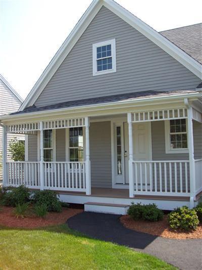 78 Brookside Road, Unit 204 Bourne, MA 02532 - Photo 1 of 3 a front view of a house with a garden