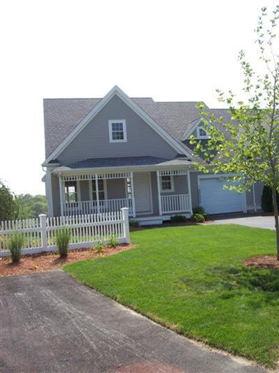 78 Brookside Road, Unit 204 Bourne, MA 02532 - Photo 3 of 3 a front view of a house with a garden