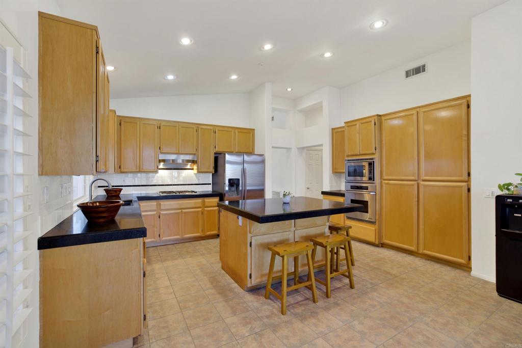 2022 Highland View Escondido, CA 92026 - Photo 12 of 47 a kitchen with a sink appliances and cabinets
