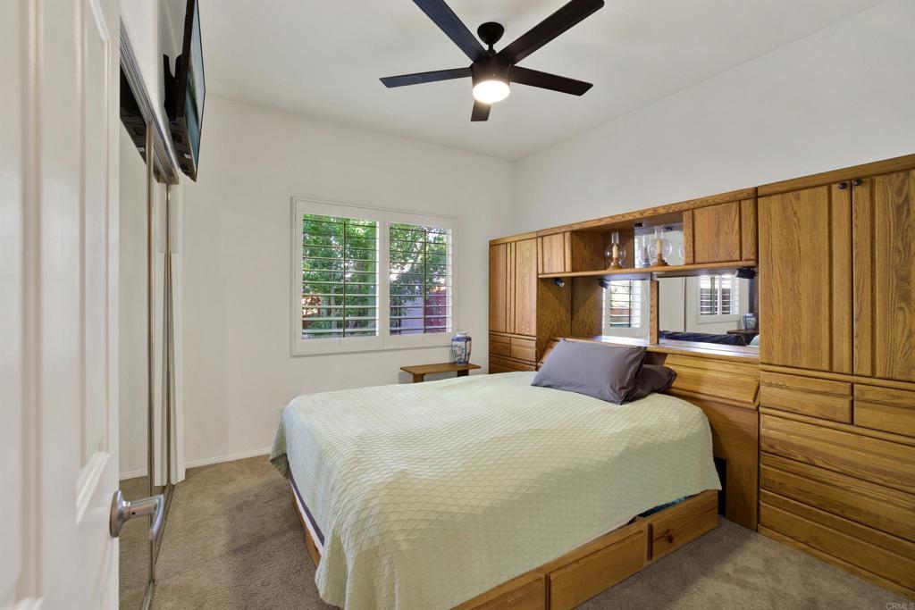 2022 Highland View Escondido, CA 92026 - Photo 17 of 47 a bedroom with a bed and a large window