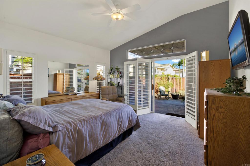 2022 Highland View Escondido, CA 92026 - Photo 19 of 47 a spacious bedroom with a bed and a large mirror