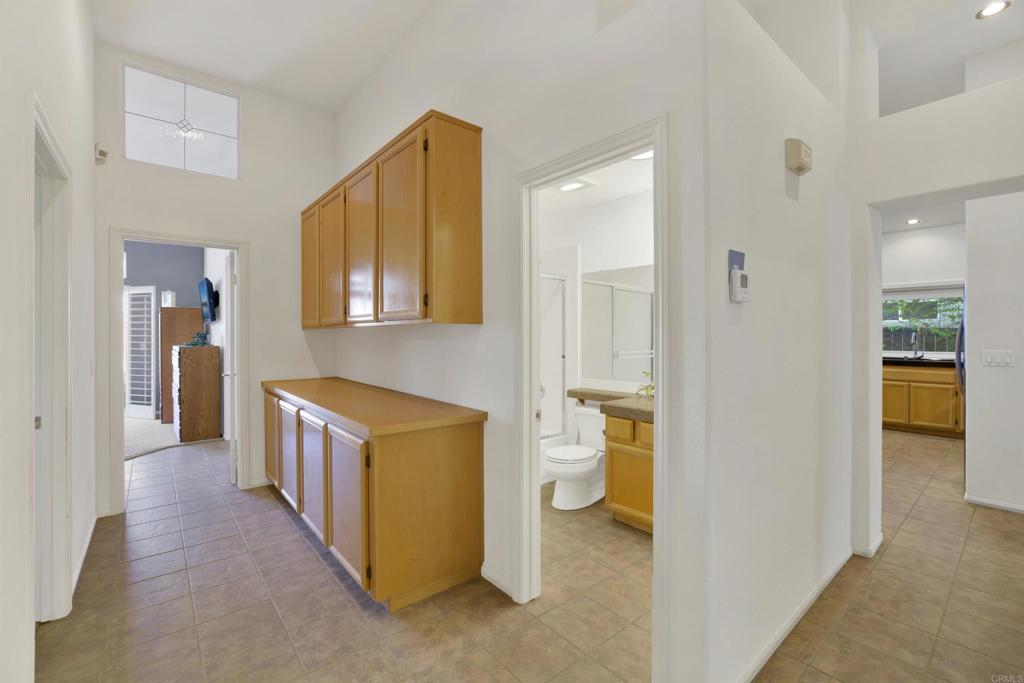 2022 Highland View Escondido, CA 92026 - Photo 21 of 47 a view of a hallway with bathroom and wooden floor