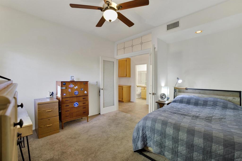 2022 Highland View Escondido, CA 92026 - Photo 31 of 47 a bedroom with a bed and ceiling fan