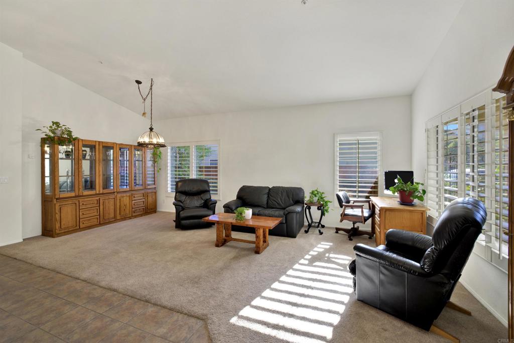 2022 Highland View Escondido, CA 92026 - Photo 8 of 47 a living room with furniture large window and flat screen tv